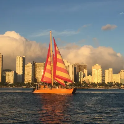 a large body of water with a city in the background