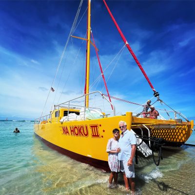a group of people on a boat in the water