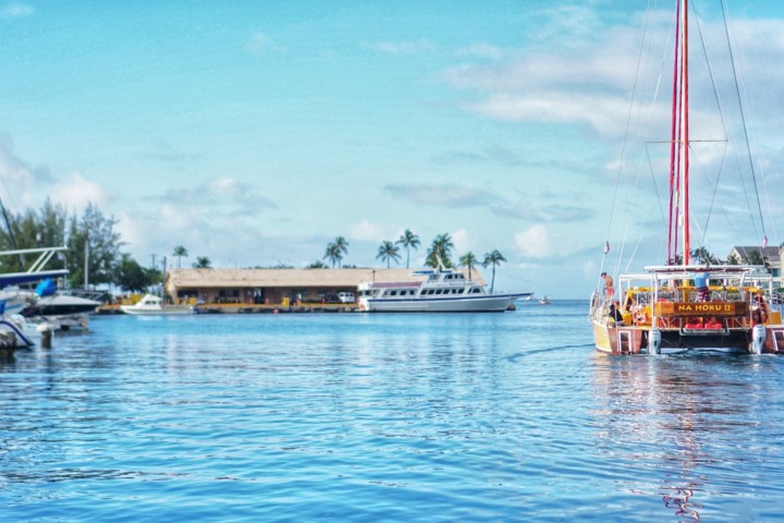 a boat is docked next to a body of water